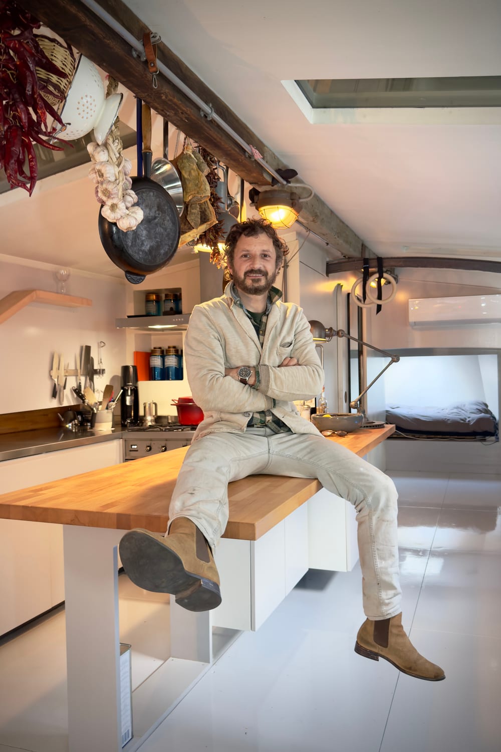 Giuseppe Carli seated in the completed boat interior
